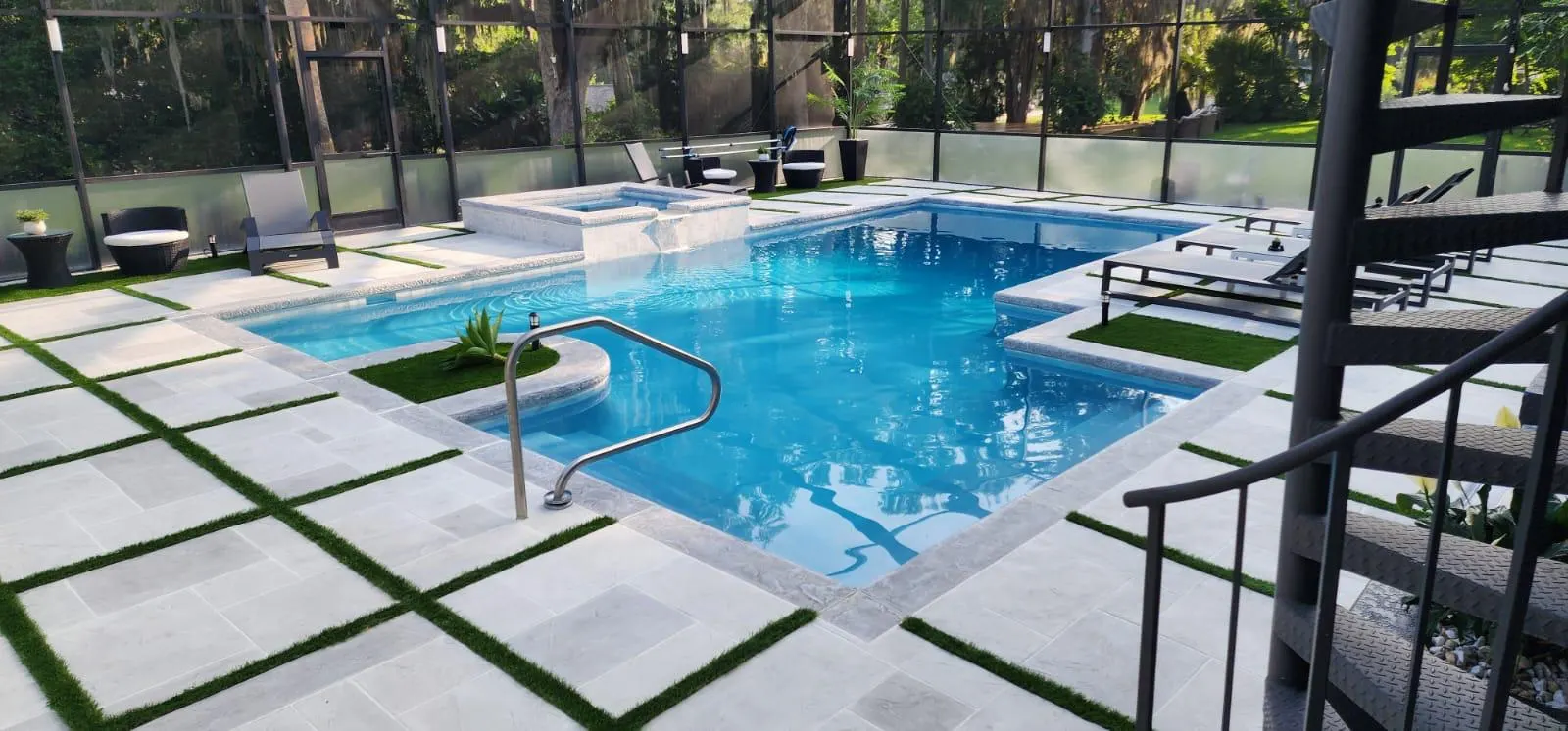 Custom concrete pool deck and patio installation beside a residential swimming pool